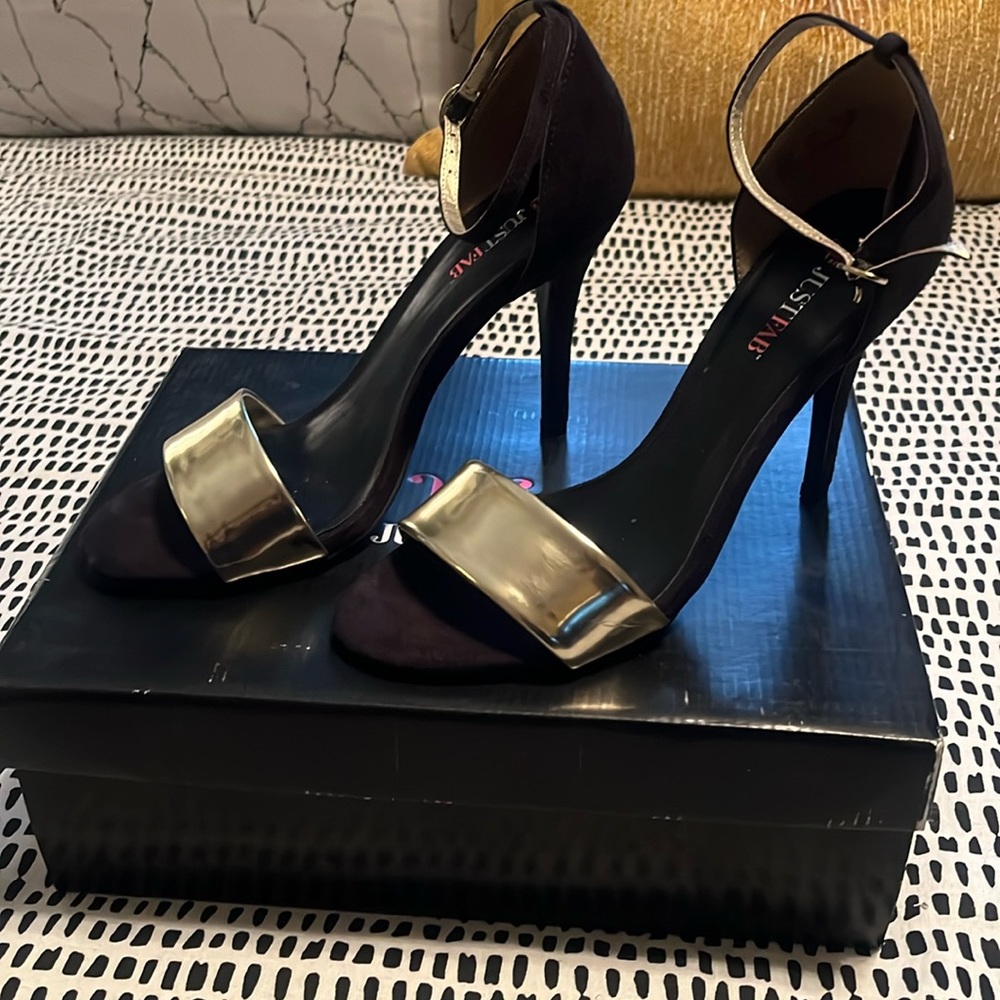 Just Fab Black and Gold Carilo heel with strap and gold buckle.